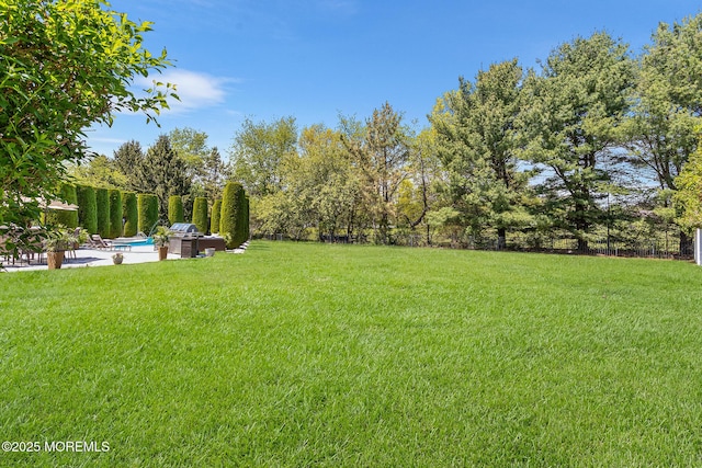 view of yard featuring a fenced backyard and an outdoor pool