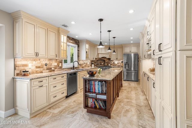 kitchen featuring light stone countertops, open shelves, stainless steel appliances, cream cabinetry, and backsplash