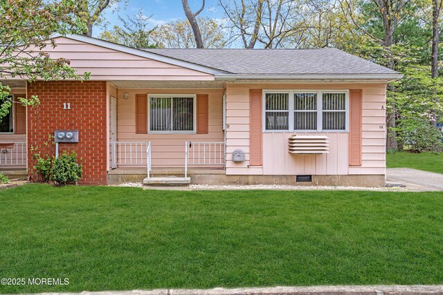 11A Hawaii Way, Whiting, NJ 08759 - single story home featuring a porch, a shingled roof, a front lawn, and brick siding
