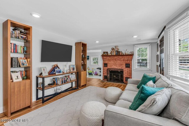 4 W Lake Rd, Red Bank, NJ 07701 - living area with wood finished floors, a fireplace, recessed lighting, and built in features