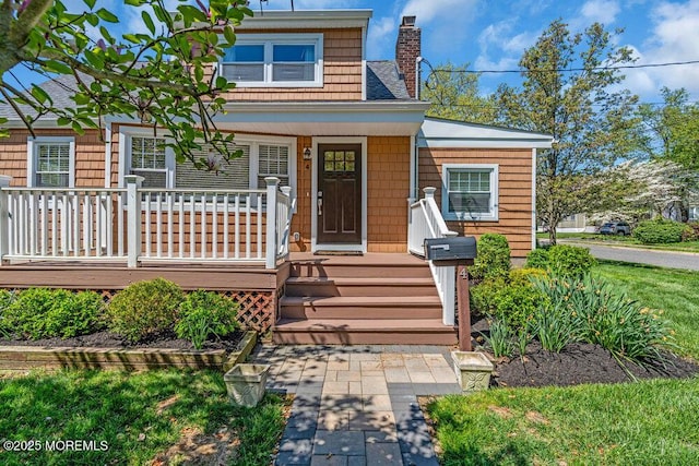 4 W Lake Rd, Red Bank, NJ 07701 - view of front of home featuring a chimney and covered porch