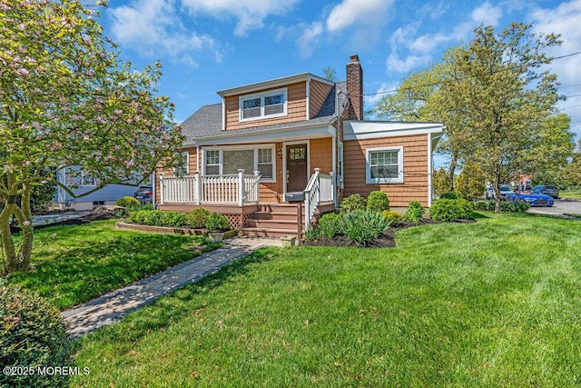 4 W Lake Rd, Red Bank, NJ 07701 - bungalow with a chimney, a front yard, and covered porch