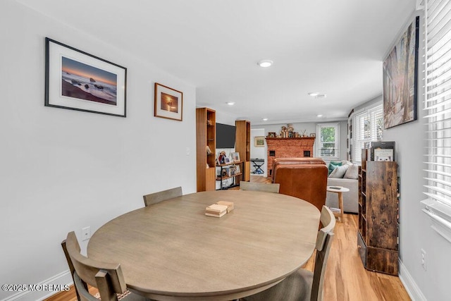 4 W Lake Rd, Red Bank, NJ 07701 - dining space featuring light wood-style floors, a fireplace, recessed lighting, and baseboards