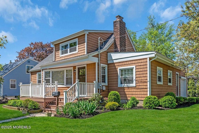 4 W Lake Rd, Red Bank, NJ 07701 - bungalow-style home featuring a chimney, a front lawn, and a wooden deck