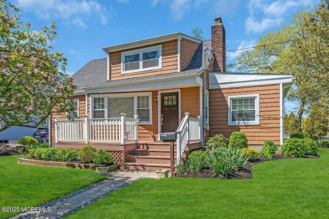 4 W Lake Rd, Red Bank, NJ 07701 - bungalow-style house featuring a chimney, a front lawn, a shingled roof, and a wooden deck
