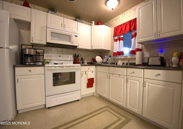 27 Moccasin Dr, Whiting, NJ 08759 - kitchen featuring white appliances, dark countertops, tasteful backsplash, and white cabinets