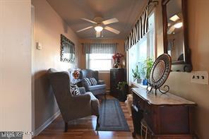 27 Moccasin Dr, Whiting, NJ 08759 - sitting room featuring a ceiling fan, wood finished floors, and baseboards