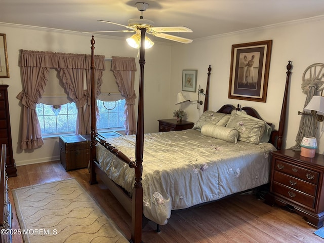 bedroom with wood finished floors, ceiling fan, and ornamental molding