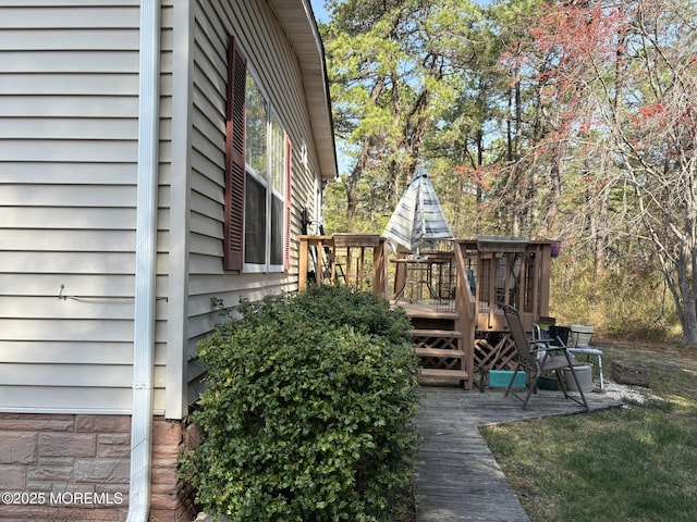 view of side of property featuring a deck
