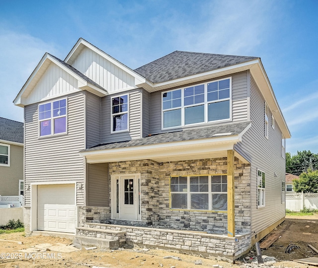 74 Manchester Ave, Keyport, NJ 07735 - view of front of house with a garage, stone siding, and a shingled roof