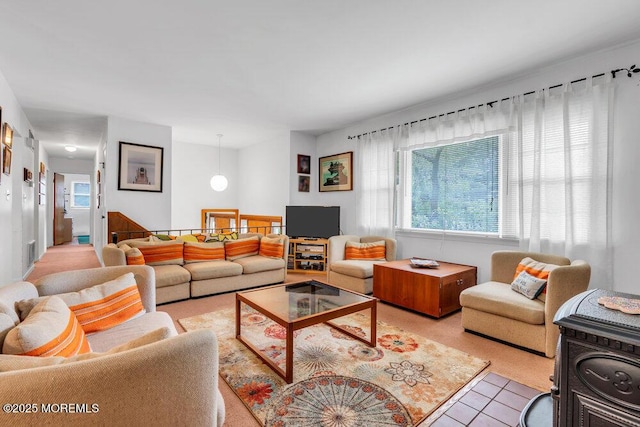 living room featuring plenty of natural light and light tile patterned flooring