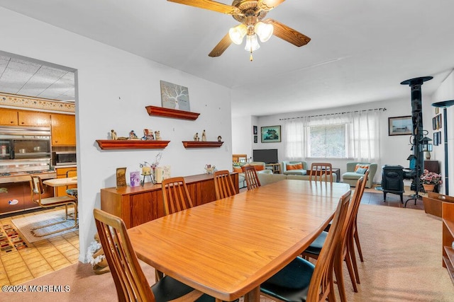 dining room featuring a ceiling fan and light tile patterned floors