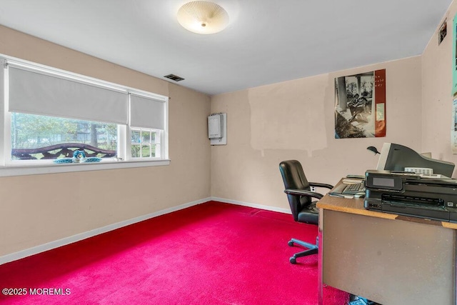 carpeted office space with baseboards
