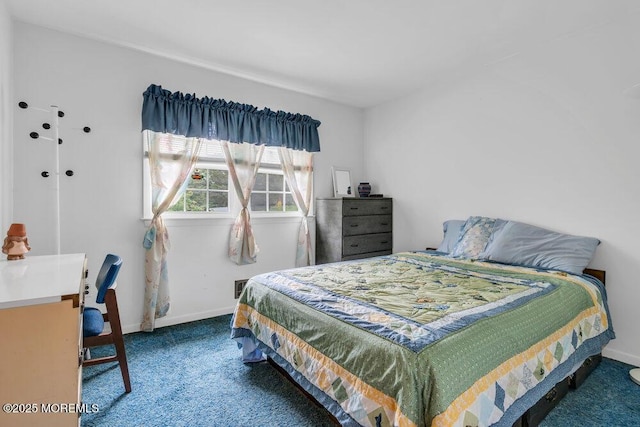bedroom with carpet and baseboards