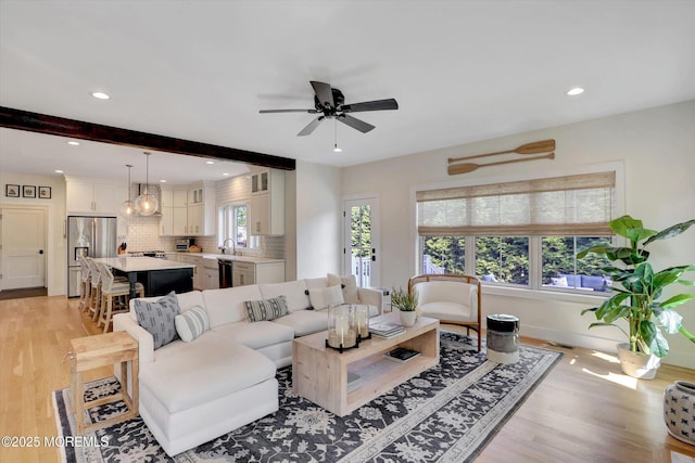 living room with ceiling fan, light wood-style floors, recessed lighting, baseboards, and visible vents