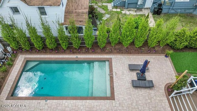 view of swimming pool featuring a swimming pool and a patio area