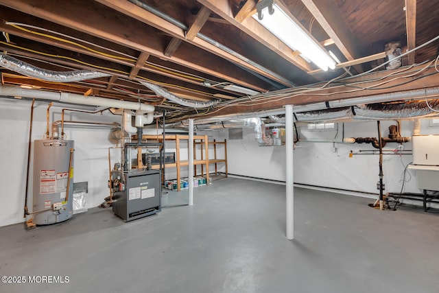 unfinished below grade area featuring gas water heater and a heating unit