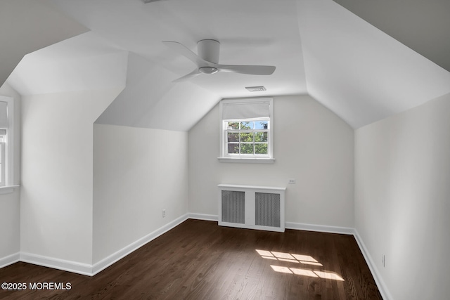 bonus room featuring baseboards, ceiling fan, wood finished floors, and visible vents