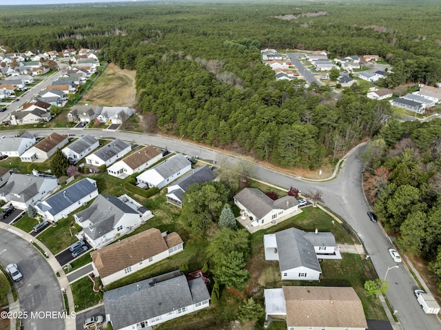 aerial view with a residential view and a wooded view