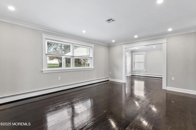 spare room featuring recessed lighting, a baseboard heating unit, and wood finished floors