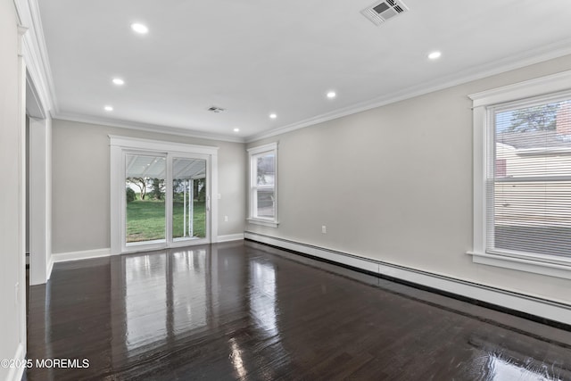 spare room featuring visible vents, recessed lighting, plenty of natural light, and a baseboard heating unit