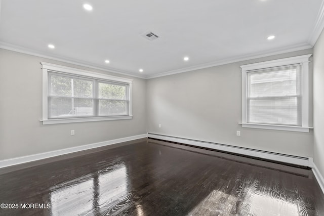 spare room with visible vents, crown molding, wood finished floors, recessed lighting, and a baseboard radiator