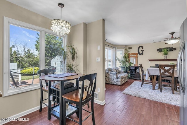 108 Longman St, Toms River, NJ 08753 - dining space featuring dark wood-style flooring, visible vents, ceiling fan with notable chandelier, and baseboards
