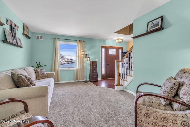 108 Longman St, Toms River, NJ 08753 - carpeted living area with stairs, visible vents, and baseboards