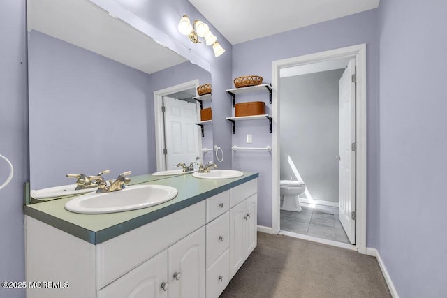 108 Longman St, Toms River, NJ 08753 - full bathroom featuring double vanity, toilet, baseboards, and a sink