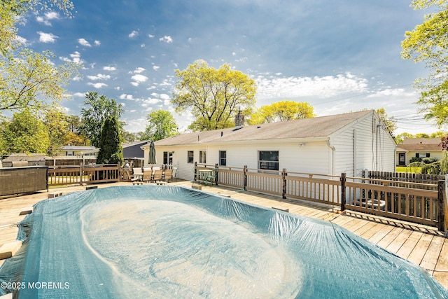 view of swimming pool featuring a wooden deck
