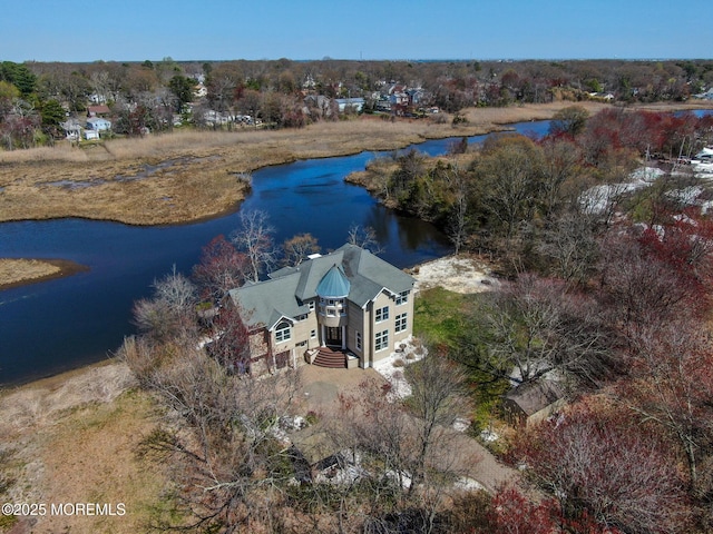 drone / aerial view with a water view