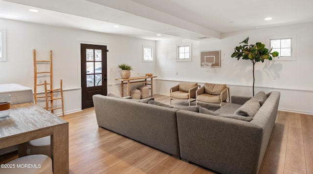 living area with light wood finished floors, recessed lighting, and baseboards