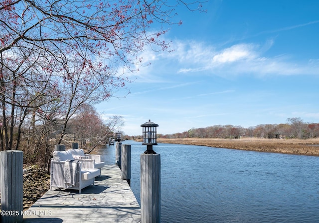 view of dock with a water view