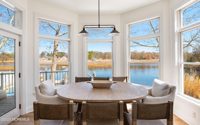 sunroom with a water view