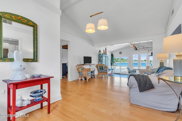 405 Sunset Dr S, Berkeley, NJ 08721 - living area featuring baseboards, high vaulted ceiling, visible vents, and wood finished floors
