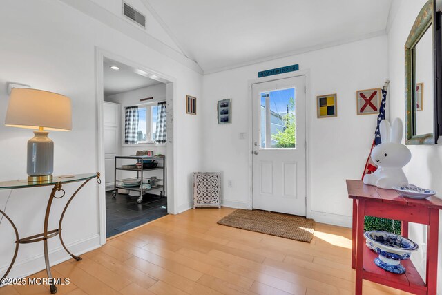 405 Sunset Dr S, Berkeley, NJ 08721 - entrance foyer with lofted ceiling, a wealth of natural light, visible vents, and wood finished floors