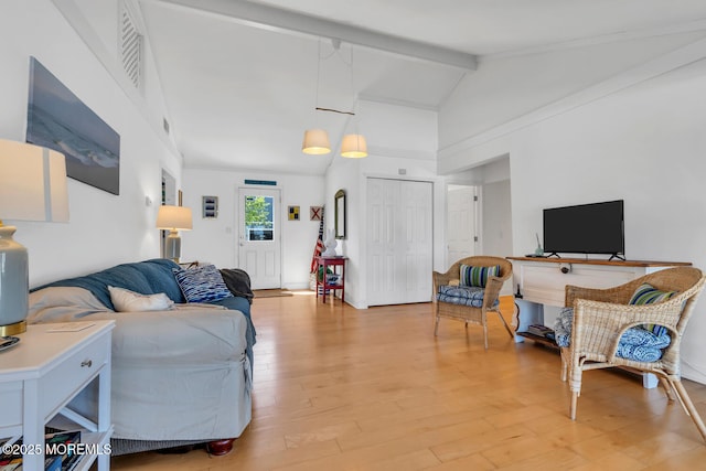 405 Sunset Dr S, Berkeley, NJ 08721 - living area with light wood finished floors, high vaulted ceiling, visible vents, and beam ceiling