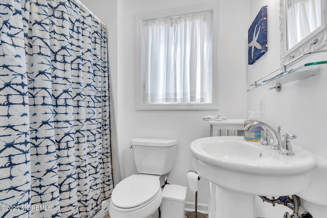 405 Sunset Dr S, Berkeley, NJ 08721 - bathroom featuring a sink, toilet, and a shower with shower curtain