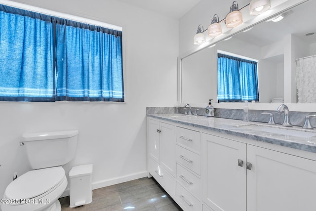 405 Sunset Dr S, Berkeley, NJ 08721 - bathroom featuring toilet, baseboards, and double vanity