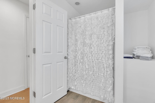 405 Sunset Dr S, Berkeley, NJ 08721 - bathroom featuring a shower with curtain and wood finished floors