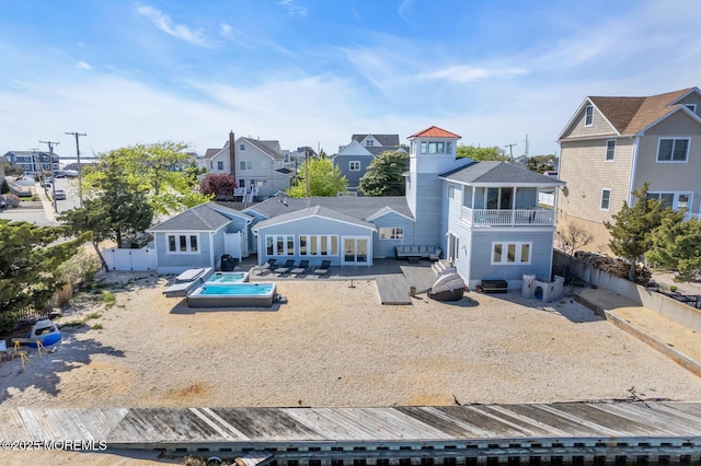 405 Sunset Dr S, Berkeley, NJ 08721 - back of property featuring a fenced backyard, a patio area, a residential view, and a balcony
