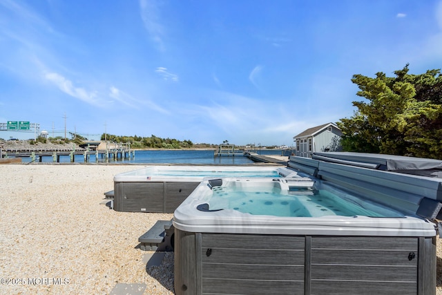405 Sunset Dr S, Berkeley, NJ 08721 - view of pool featuring a hot tub and a water view