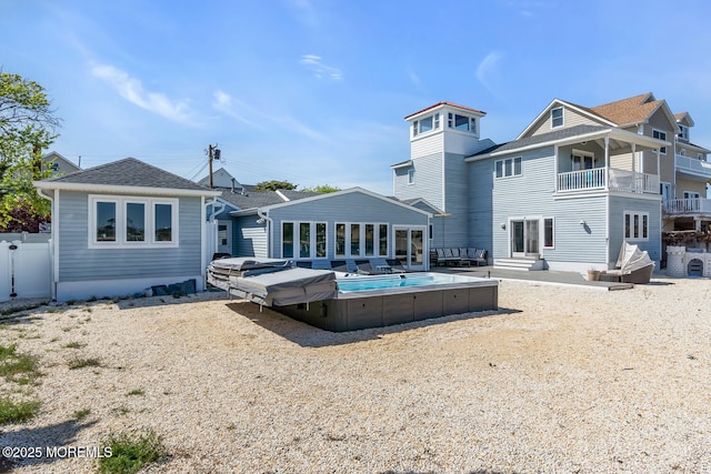405 Sunset Dr S, Berkeley, NJ 08721 - rear view of house featuring a balcony, a patio area, and fence