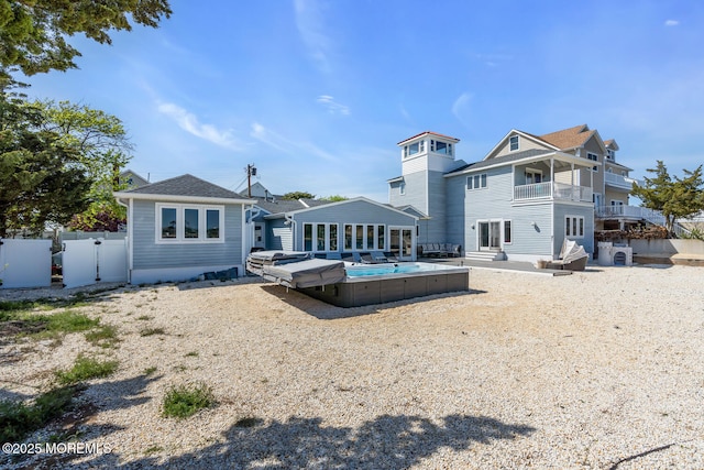 405 Sunset Dr S, Berkeley, NJ 08721 - back of property featuring a balcony, a patio area, and fence