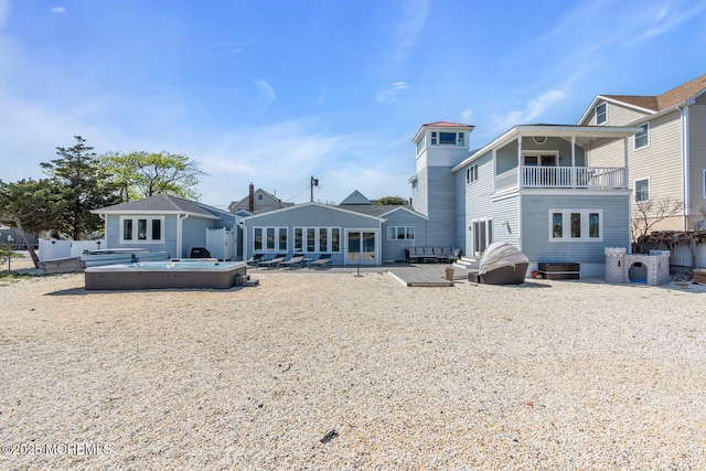 405 Sunset Dr S, Berkeley, NJ 08721 - back of property with a balcony, a hot tub, and a patio