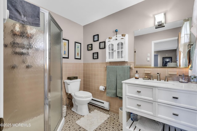 bathroom featuring toilet, tile patterned floors, tile walls, a shower stall, and a baseboard heating unit