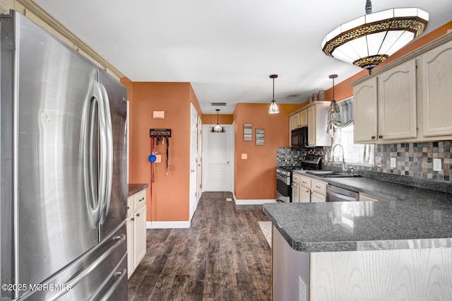 12 Red Maple Ct, South Toms River, NJ 08757 - kitchen featuring dark countertops, a sink, dark wood-style flooring, and stainless steel appliances