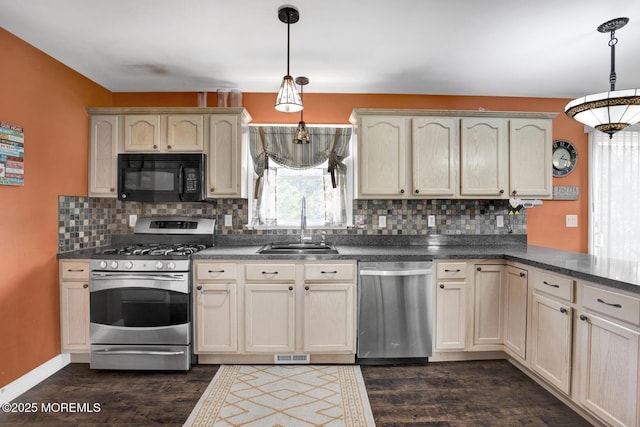 12 Red Maple Ct, South Toms River, NJ 08757 - kitchen featuring dark wood-style floors, backsplash, a sink, and appliances with stainless steel finishes