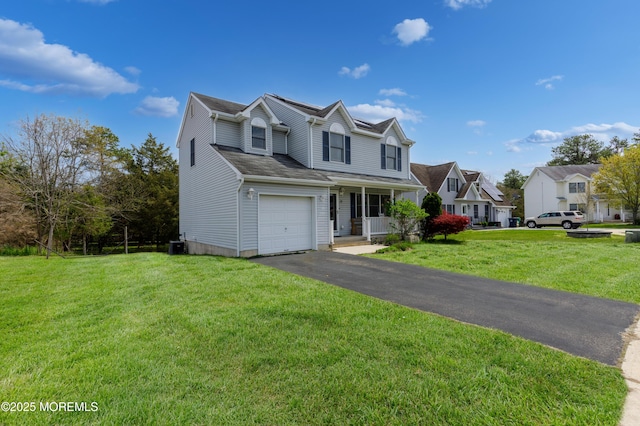 12 Red Maple Ct, South Toms River, NJ 08757 - traditional-style house featuring aphalt driveway, a front yard, a porch, and an attached garage