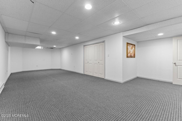 finished below grade area with carpet floors, recessed lighting, and baseboards